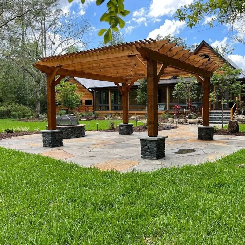 a pergola over a stone patio